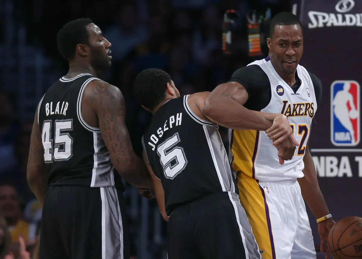 Dwight Howard #12 of the Los Angeles Lakers receives a technical foul after tussling with Cory Joseph #5 of the San Antonio Spurs in the first half of Game Four of the Western Conference Quarterfinals of the 2013 NBA Playoffs at Staples Center on April 28, 2013. (Jeff Gross/Getty Images)