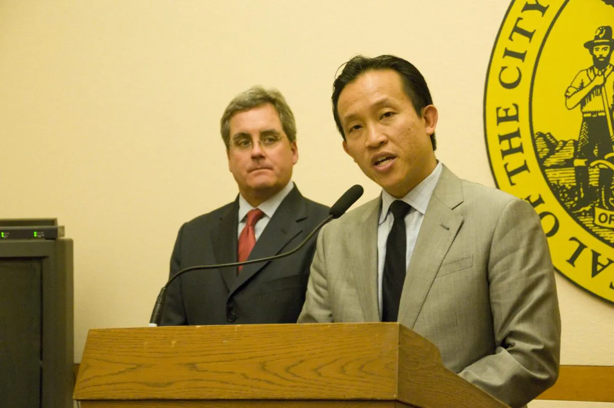 Board of Supervisors President David Chiu speaks while City Attorney Dennis Herrera looks on at San Francisco City Hall, April 23, 2013. (Lear Zhou/The Epoch Times)