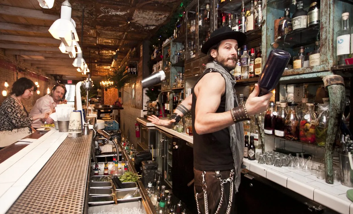 Paolo Votano, co-owner of Oficina Latina, regularly bartends but rarely juggles with the bottles. (Samira Bouaou/Epoch Times)