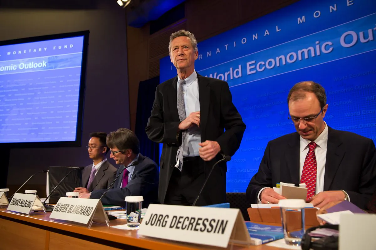 Abdul de Guia Abiad (L), Deputy Division Chief, Research Department; Thomas Helbling (2nd L), Division Chief, Research Department IMF; Economic Counsellor and Director of the Research Department, Olivier Blanchard (C); and Deputy Director of the Research Department, Jorg Decressin (R) hold a joint press conference on the World Economic Outlook at IMF headquarters in Washington, on April 16, 2013. (Stephen Jaffe/IMF via Getty Images)