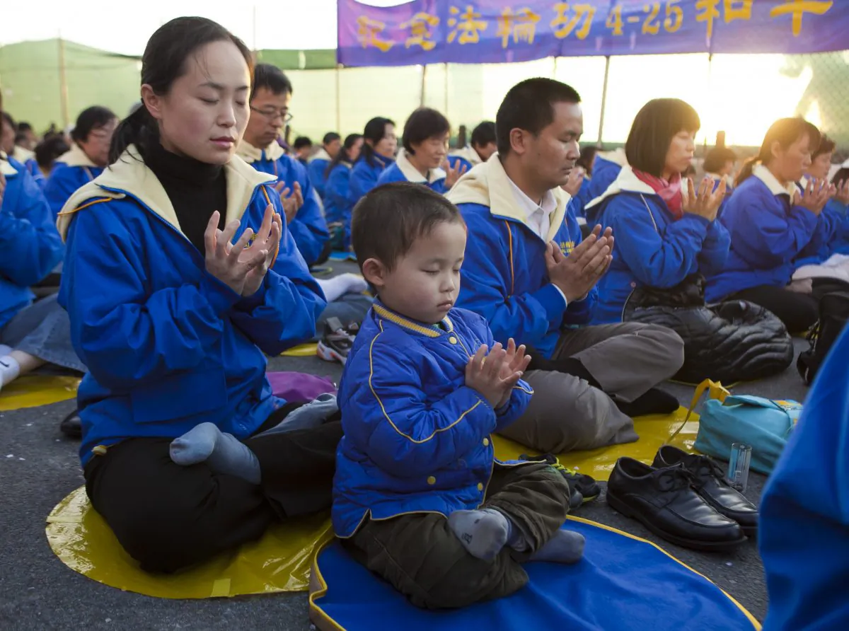 Falun Gong practitioners gather in New York on April 25 for a candlelight vigil in front of the Chinese Consulate. The day, 14 years ago, marks an historic, peaceful appeal in China that was later used as justification to launch a state-sanctioned persecution against the meditation practice of Falun Gong. (Samira Bouaou/Epoch Times)