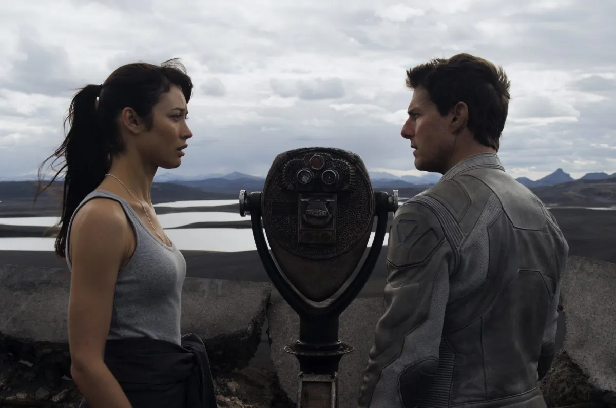 Julia (Olga Kurylenko) provides Jack (Tom Cruise) clues to his past in "Oblivion", an original and groundbreaking cinematic event from the visionary director of "TRON: Legacy"and producers of "Rise of the Planet of the Apes." (Courtesy of Universal Pictures)

