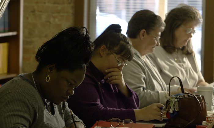 Eela Cox, (L),33, studies world geography at the Adult Basic Education office in Lumberton, North Carolina, in this file photo with other women who brushing up on basics to enable them to get their GED or High School diploma. States across the country are developing alternatives to the GED. (Paul J. Richards/AFP/Getty Images) 