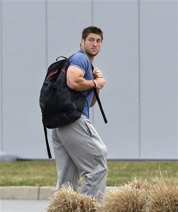 FILE - In this Monday, April 15, 2013 file photo, New York Jets quarterback Tim Tebow arrives on the first day of NFL football offseason workouts at the Jets practice facility in Florham Park, N.J. The New York Jets waived Tebow on April 29. (AP Photo/Mel Evans, File)