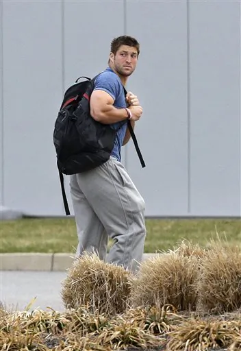 FILE - In this Monday, April 15, 2013 file photo, New York Jets quarterback Tim Tebow arrives on the first day of NFL football offseason workouts at the Jets practice facility in Florham Park, N.J. The New York Jets waived Tebow on April 29. (AP Photo/Mel Evans, File)