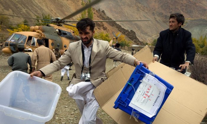 Afghan electoral commission workers unload election material from a helicopter on Nov. 1, 2009, in the remote village of Kofab, Afghanistan. The 2009 election was wrought with fraud, which observers hope will not be the case in 2015. (Paula Bronstein/Getty Images) 