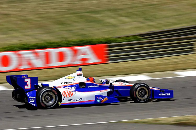 Helio’s #3 Penske Dallara-Chevrolet, sponsored by AAA and bearing the racing snail Turbo from the movie of the same name, rounds Turn Five, called “Charlotte’s Web,” during practice at Barber Motorsports Park. (James Fish/The Epoch Times)