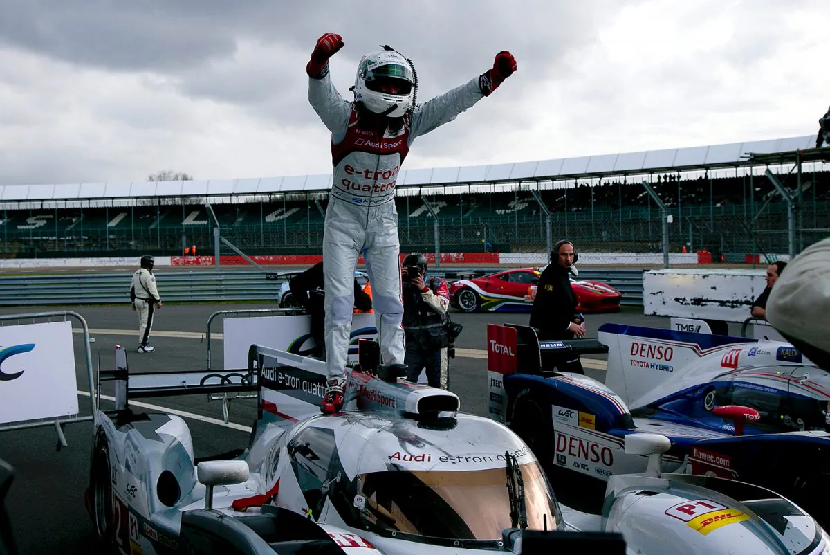 Allan McNish exults atop the race-winning No.2 Audi e-tron quattro after the WEC 6 Hours of Silverstone. (Audi Motorsports)