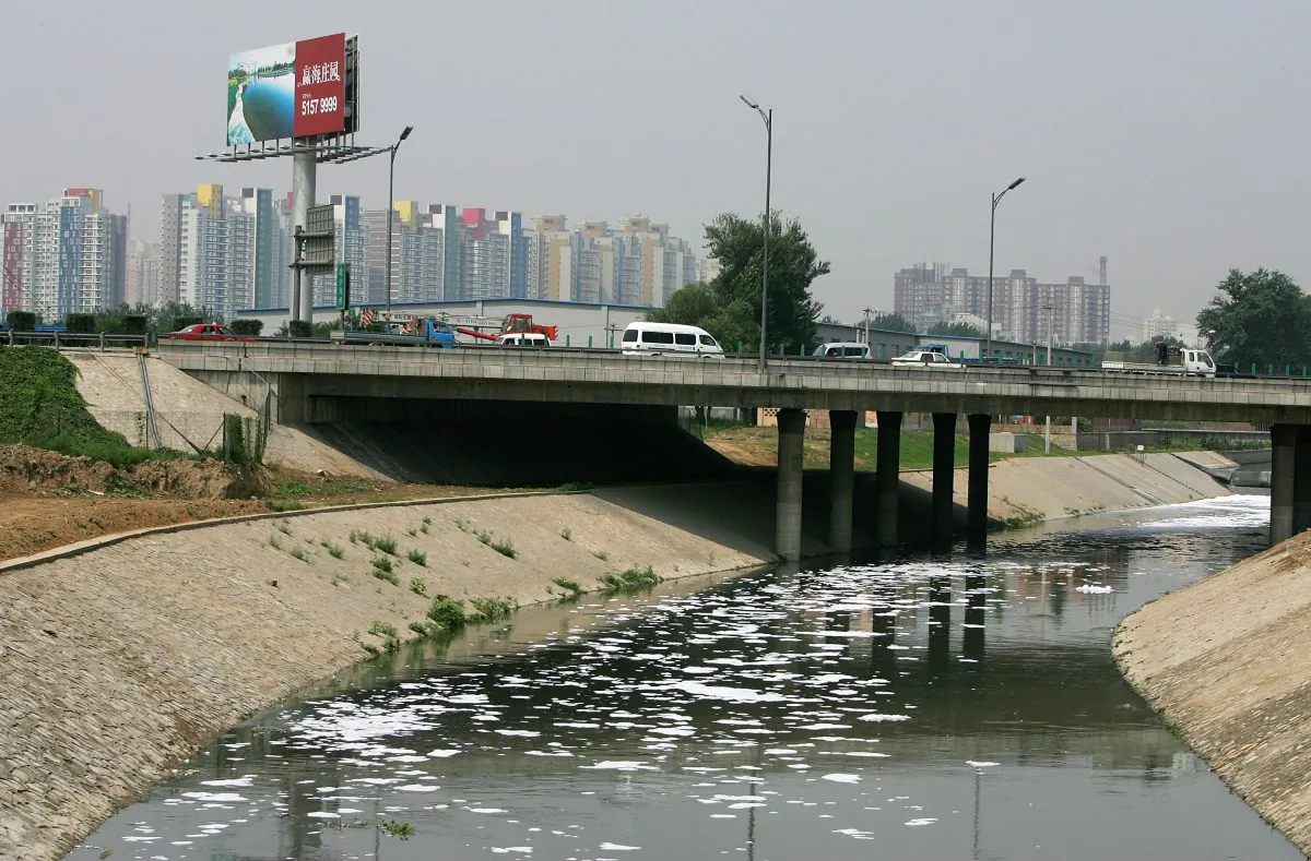Industrial waste water flows into the Bei Xiaohe River on June 25, 2007 in Beijing, China. Water pollution is a severe environmental problem in China and contributes to high cancer rates. (Guang Niu/Getty Images)