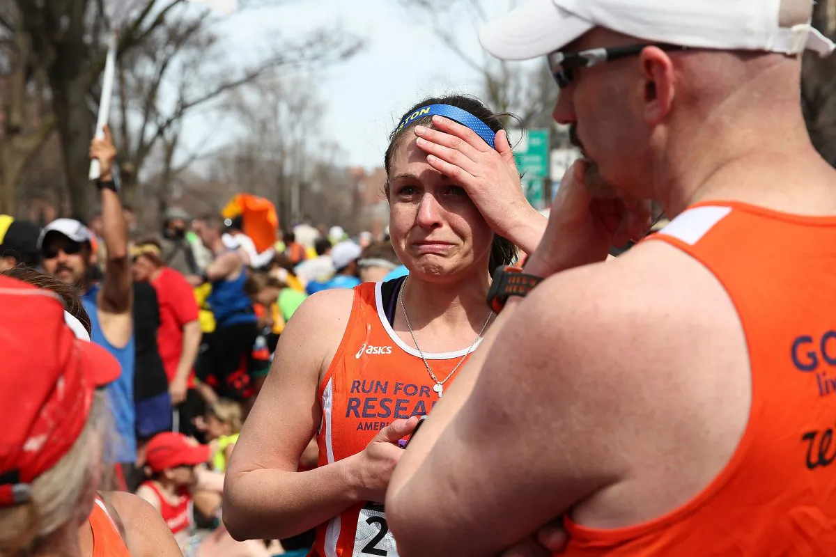 A runner reacts near Kenmore Square after two bombs exploded during the 117th Boston Marathon on April 15, 2013 in Boston, Massachusetts. (Alex Trautwig/Getty Images)