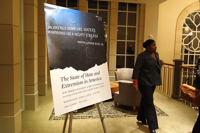A board displays a quote from Old Testament prophet Amos and Martin Luther King, "Until justice rolls down like water and righteousness like a mighty stream." (Mary Silver/Epoch Times Staff)