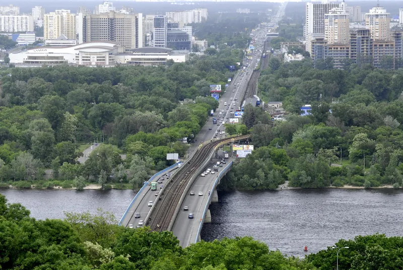 Panorama of the Dnipro River in Kyiv with residential buildings in the background. Most young families in Ukraine can't afford housing. (Vladimir Borodin/The Epoch Times)
