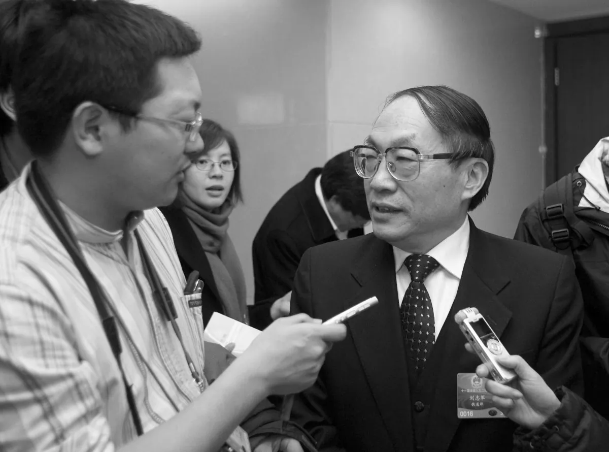 Liu Zhijun (R) being interviewed in Beijing in 2009. (STR/AFP/Getty Images)
