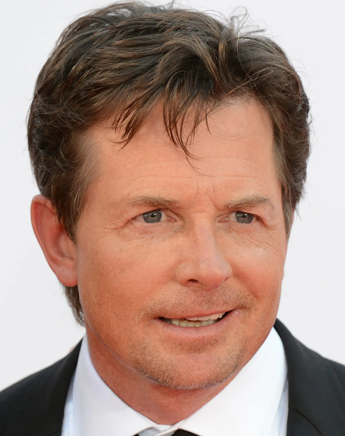 A file photo of actor Michael J. Fox arriving for the 64th annual Prime Time Emmy Awards at the Nokia Theatre at LA Live in Los Angeles, California Sept. 23, 2012. Fox will star in an NBC show starting fall 2013. (Robyn Beck/AFP/GettyImages)