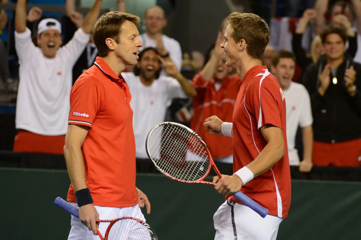 Canada's Daniel Nestor (L) and Vasek Pospisil won the crucial doubles match against Italy in Davis Cup quarterfinal play on Saturday, April 6 at the Doug Mitchell Thunderbird Sports Centre in Vancouver.
(Don MacKinnon/AFP/Getty Images) 