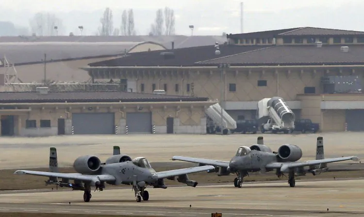 U.S. Air Force A-10 attack aircrafts wait to take off on the runway during their military exercise at the Osan U.S. Air Base in Pyeongtaek, south of Seoul, South Korea, Tuesday, April 2, 2013. (AP Photo/Bae Jung-hyun, Yonhap)