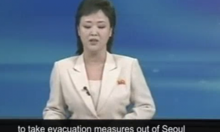 This screenshot of a Guardian video shows South Korean news media reading a statement issued by North Korea’s Asia-Pacific Peace Committee urging all foreigners in South Korea to evacuate to ensure their safety.  (Screenshot by The Epoch Times)