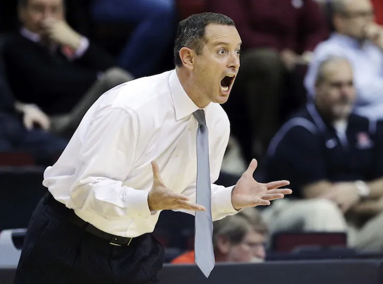 In this Jan. 17, 2013 file photo, Rutgers head coach Mike Rice reacts to play during the first half of an NCAA college basketball game against South Florida in Piscataway, N.J. Rutgers has fired Rice, following three largely unsuccessful seasons, after a videotape aired showing him shoving, grabbing and throwing balls at players in practice and using gay slurs during practice. (AP Photo/Mel Evans, File)