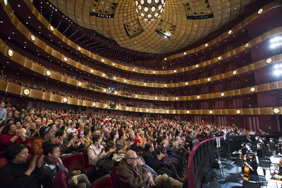 The audience at David H. Koch Theater at Lincoln Center in New York City applauds for Shen Yun Performing Arts on April 20. (Dai Bing/The Epoch Times)