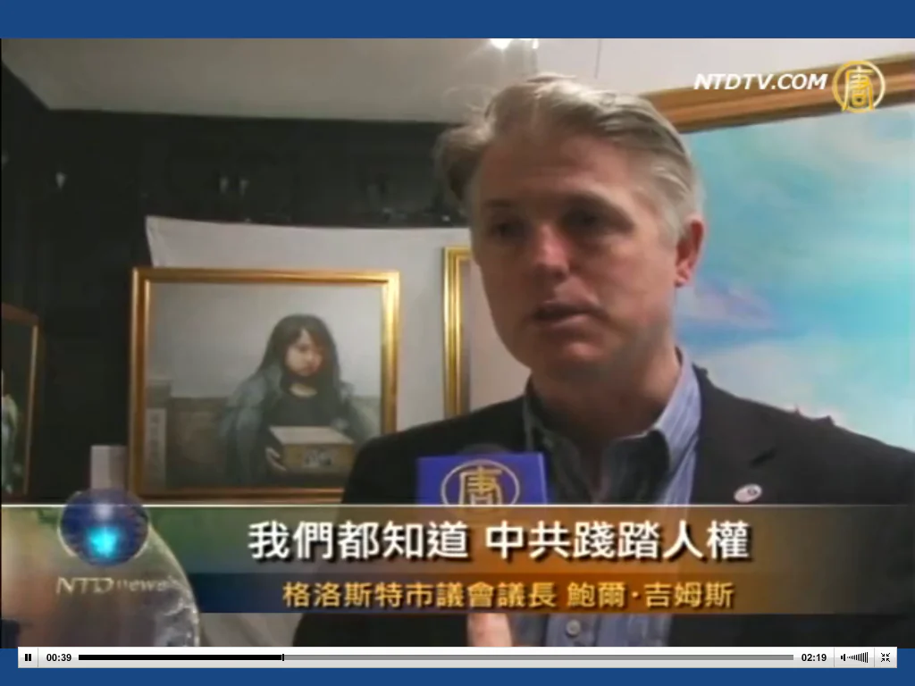 Leader of Gloucester Council, Cllr
Paul James, talking to NTD Television. He was at the Private View of The Art of Zhen Shan Ren Exhibition at the Tiger’s Eye at The Old Bell on April 3rd. (Courtesy of NTD Television)