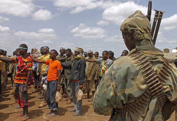 Members of the Al-Qaeda-linked Shebab standing after giving themselves up to forces of the African Union Mission in Somalia (AMISOM) in Garsale, north of the capital, Mogadishu, on Sept. 22, 2012. (Mohamed Abdiwahab/AFP/GettyImages)