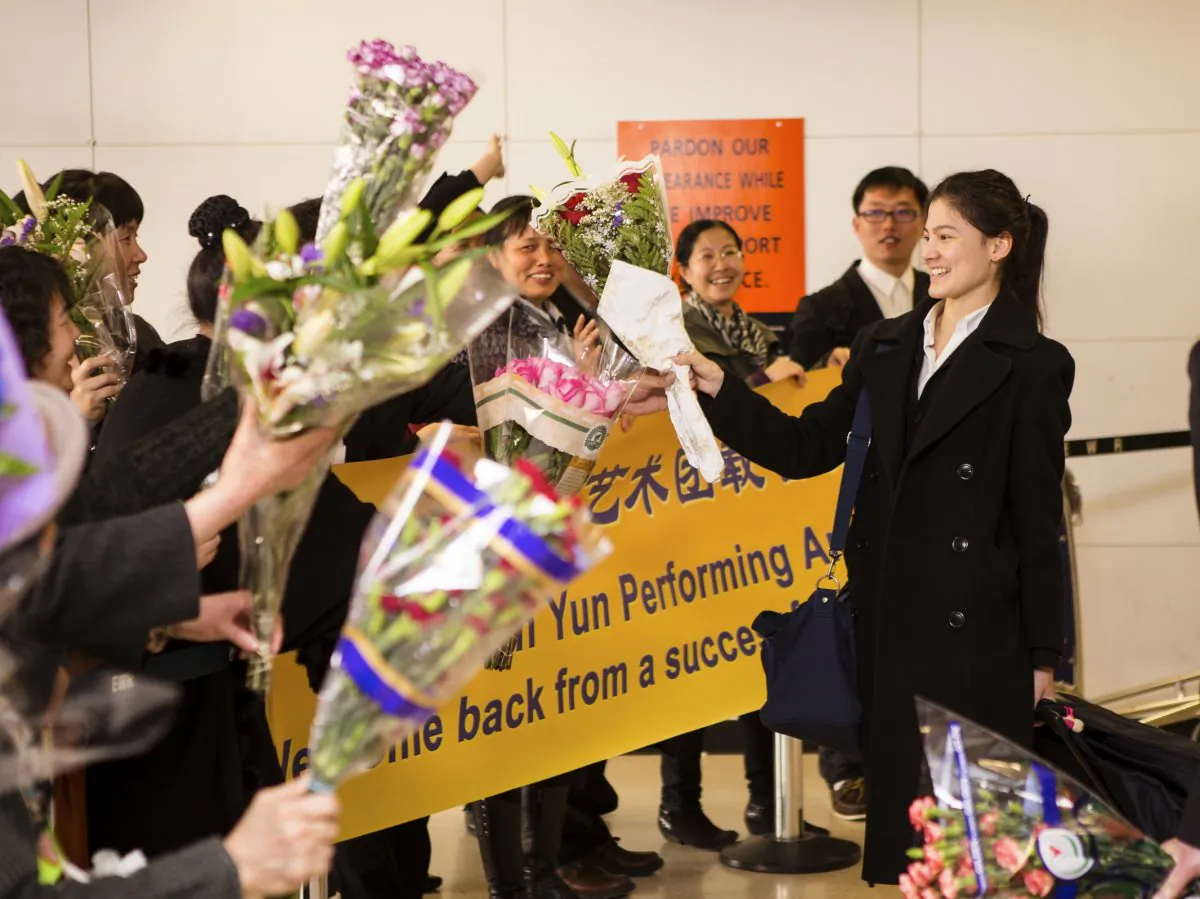 The Shen Yun Performing Arts New York company is welcomed home by supporters at the Newark airport in New Jersey after a successful European tour April 15, 2013. (Edward Dai/Epoch Times)