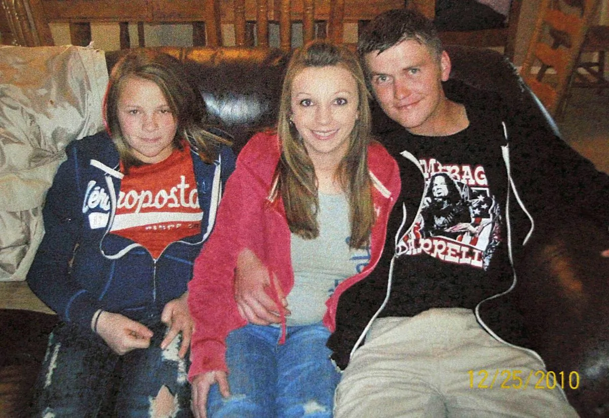 This Dec. 25, 2010 file photo provided by Clint Dunn shows his 13-year-old daughter, Hailey Dunn, left, poses for a photo with her mother Billie Jean Dunn, center, and her mother's boyfriend Shawn Adkins on Christmas day in Colorado City, Texas.  (AP Photo/Courtesy of Clint Dunn, File)