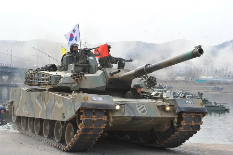 A South Korean K-1 tank moves over a temporary bridge during a river-crossing military drill in Hwacheon near the border with North Korea on April 1. The United States sent F-22 fighter jets to join the South Korean Drills. (Kim Jae-Hwan/AFP/Getty Images)