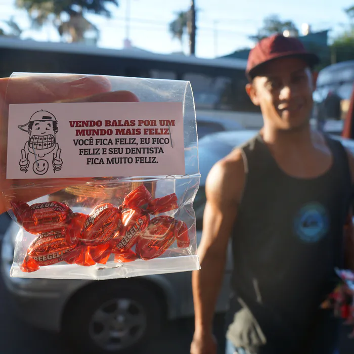 "I sell candy to create a happy world, you're happy, I'm happy, and your dentist is very happy," reads a candy label part of a marketing project to prove words have the power to inspire positive change in people's lives. (Courtesy of Will Ferreira Jr. and Alexandre Freire)