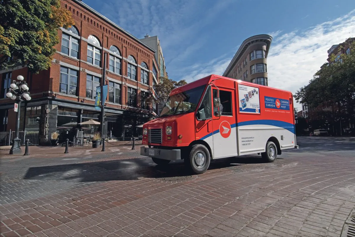 A Canada Post truck is parked in Vancouver’s Gastown. The decline in mail volume due to digital alternatives is projected to push Canada Post to an annual operating loss of $1 billion by 2020, according to a new report. (Courtesy Canada Post)