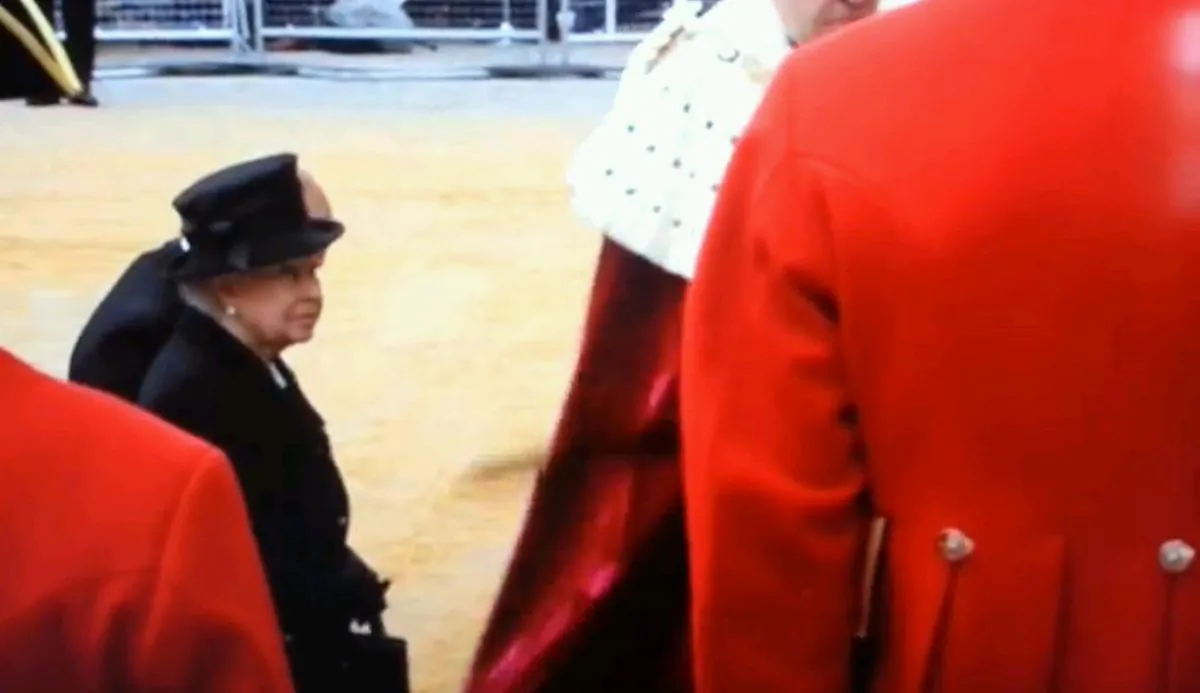 A screenshot of YouTube shows Queen Elizabeth moving away from a sword.