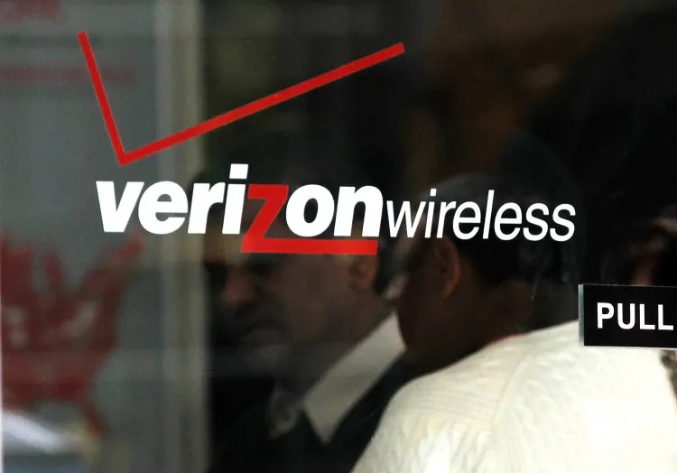A Verizon Wireless sales associate is seen inside a Verizon Wireless store in New York City. Verizon Wireless is considered one of the best mobile assets on the planet by analysts. (Justin Sullivan/Getty Images)