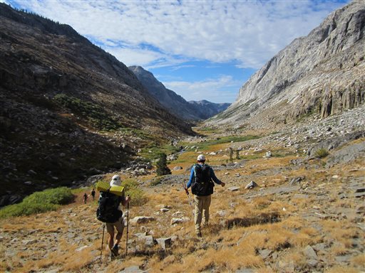 Hikers making their way through an area of Yosemite National Park that lacks trails in Stubblefield Canyon. Outdoor adventurer Andrew Skurka, pictured on the right, has hiked tens of thousands of miles alone in wild areas across the U.S., and now shares his knowledge by leading guided trips for others interested in backcountry hikes. (AP Photo/John Pain)