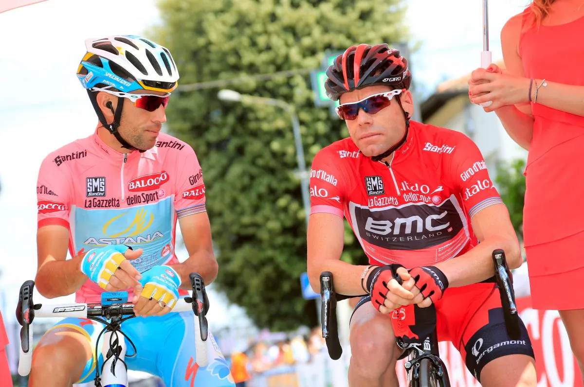 Astana’s Vincenzo Nibali (L) and BMC's Cadel Evans, in first and second place, talk before the start of the 10th stage of the 96th Giro d'Italia, May 14, 2013 in Cordenons. (Luk Benies/AFP/Getty Images)