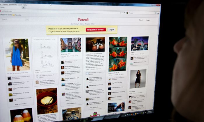 A woman looks at the internet site Pinterest.com on March 13, 2012. (Karen Bleier/AFP/Getty Images)