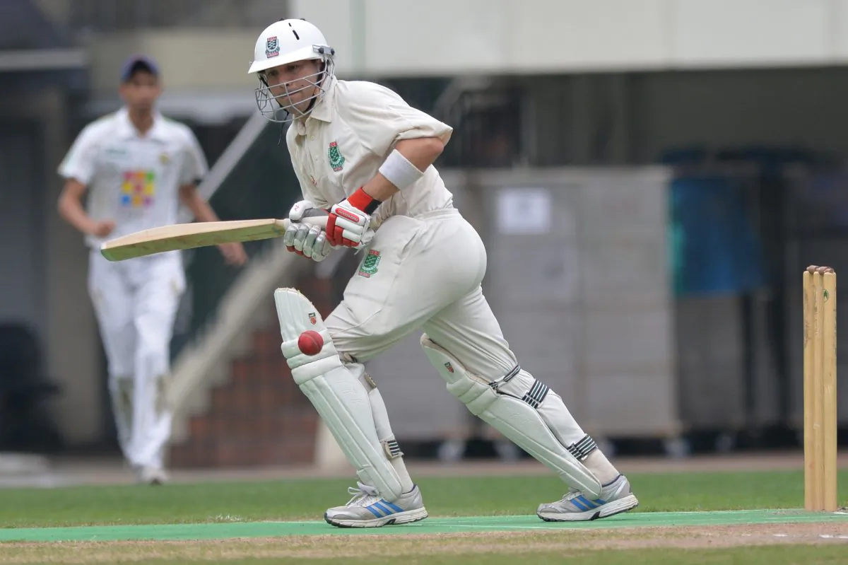 Dylan Dearing turns a ball to leg during his innings of 96 for KCC against LSW Cricket Club in the 2-Day Premier League match on Sunday April 28. KCC won the match by nine wickets to become the Hong Kong Cricket Association Pemier 2-Day Champions. (Bill Cox/The Epoch Times)