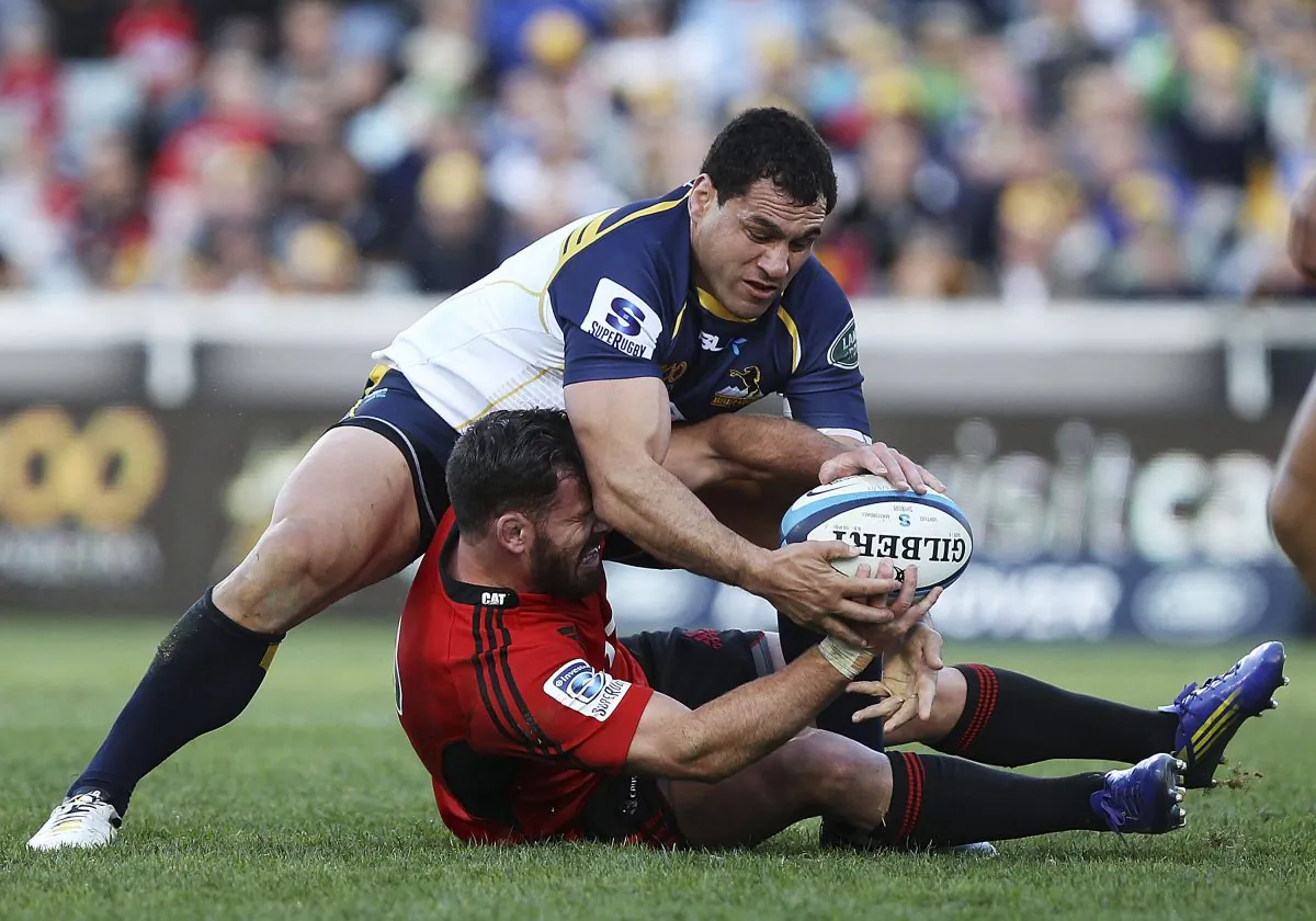 Brumbies flanker George Smith (top) tackled Crusader Ryan Crotty, released him and regained his feet according to the rules, then effected the turn-over pictured here ... all before anyone else arrived. (Stefan Postles/Getty Images)