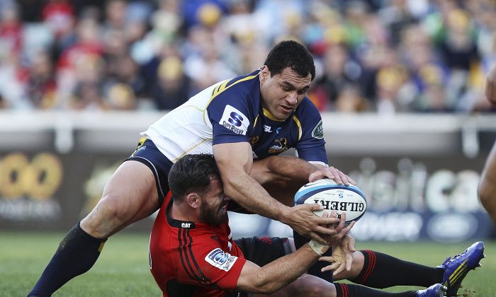 Brumbies flanker George Smith (top) tackled Crusader Ryan Crotty, released him and regained his feet according to the rules, then effected the turn-over pictured here ... all before anyone else arrived. (Stefan Postles/Getty Images)