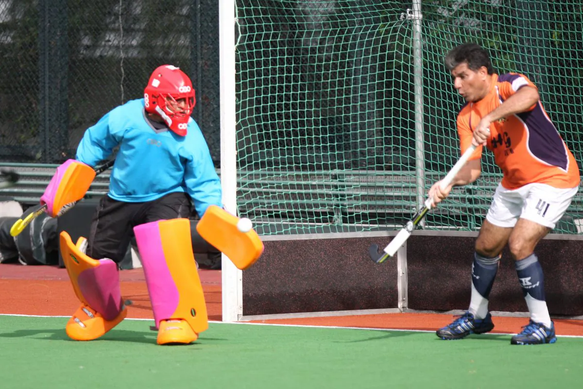 Timely save ... Singh Sabba Sports Club-B player/coach Sarjit Singh makes a valiant save on the line to deny Dutch-A a crack at goal. The deflection allowed SSSC-B to hold onto 2-all draw and later, win on a golden goal. (Eddie So)