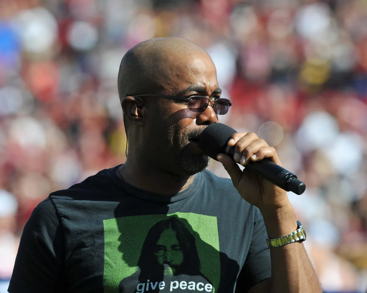 Darius Rucker sings the National Anthem before the Michigan Wolverines play against the South Carolina Gamecocks in the Outback Bowl Jan. 1, 2013 at Raymond James Stadium in Tampa, Florida. (Photo by Al Messerschmidt/Getty Images)