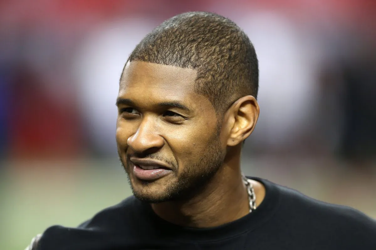 Singer Usher stands on the field during warm ups prior to the Atlanta Falcons hosting the San Francisco 49ers in the NFC Championship game at the Georgia Dome on January 20, 2013 in Atlanta, Georgia. (Streeter Lecka/Getty Images)