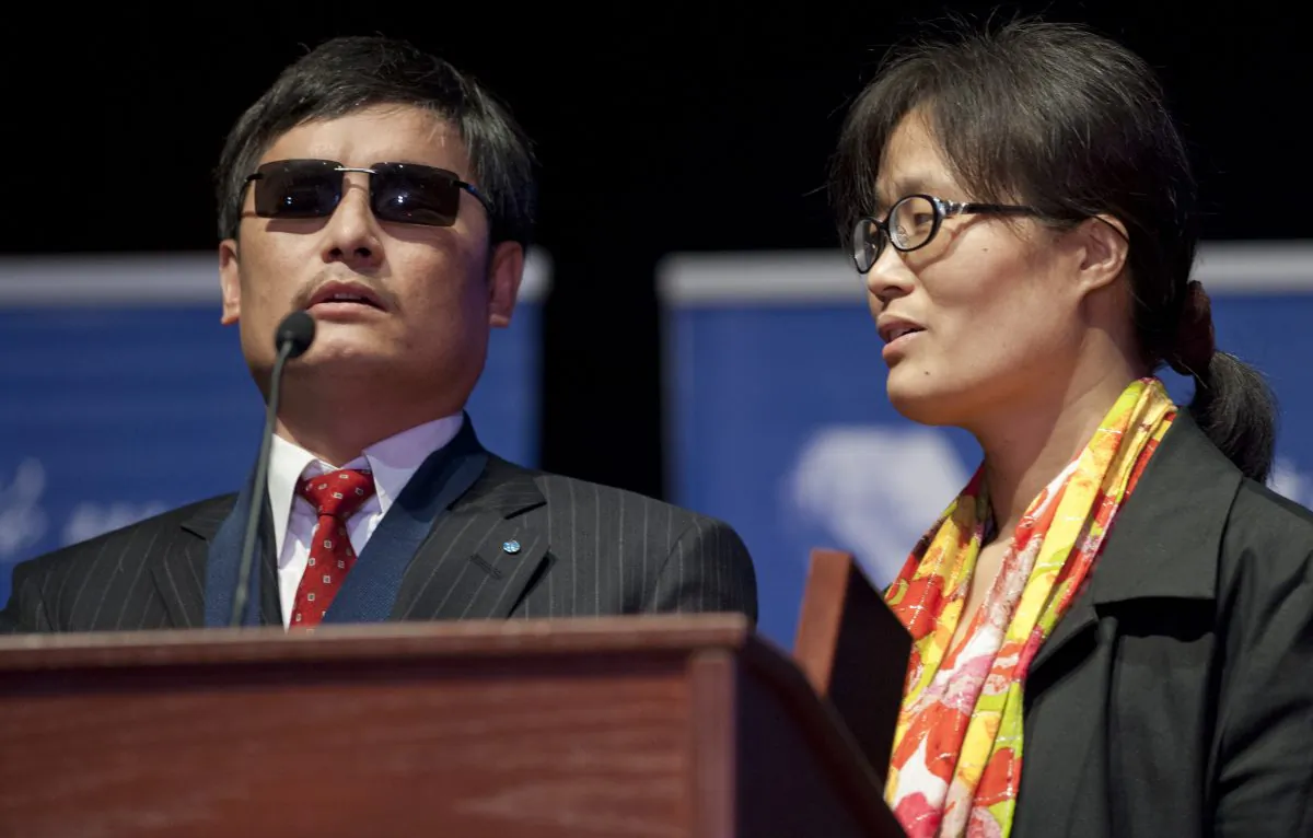 Chinese activist lawyer Chen Guangcheng speaks alongside his wife, Yuan Weijing, after being presented with the Tom Lantos Human Rights Prize during a ceremony in Washington D.C. on Jan. 29, 2013. U.S. congressional leaders have responded to Chen’s pleas for help to stop the persecution of his relatives in mainland China. (Saul Loeb/AFP/Getty Images)