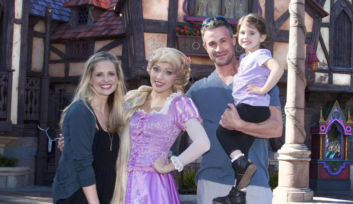 Sarah Gellar, Freddie Prinze Jr. and their daughter Charlotte, 3, meet Rapunzel at the Fantasy Faire attraction at Disneyland in Anaheim, Calif., on March 6, 2013. (Paul Hiffmeyer/Disney Enterprises, Inc. via Getty Images)