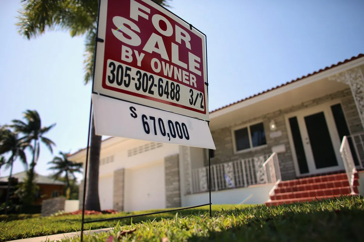 A “FOR SALE” sign stands in front of a home in Miami, Fla., March 26. Home prices have been on the rise, but it looks like another bubble is forming. (Joe Raedle/Getty Images) 