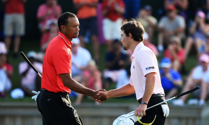  Tiger Woods of the USA shakes hands with Casey Wittenberg after finishing on the 18th green during the final round of THE PLAYERS Championship at THE PLAYERS Stadium course at TPC Sawgrass on May 12, 2013 in Ponte Vedra Beach, Florida. (Photo by Richard Heathcote/Getty Images)