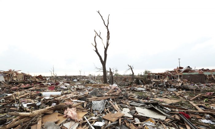 Massive piles of debris cover the ground after a powerful tornado ripped through the area on May 20, 2013 in Moore, Oklahoma. The tornado, reported to be at least EF4 strength touched down in the Oklahoma City area on Monday killing at least 51 people. (Brett Deering/Getty Images)