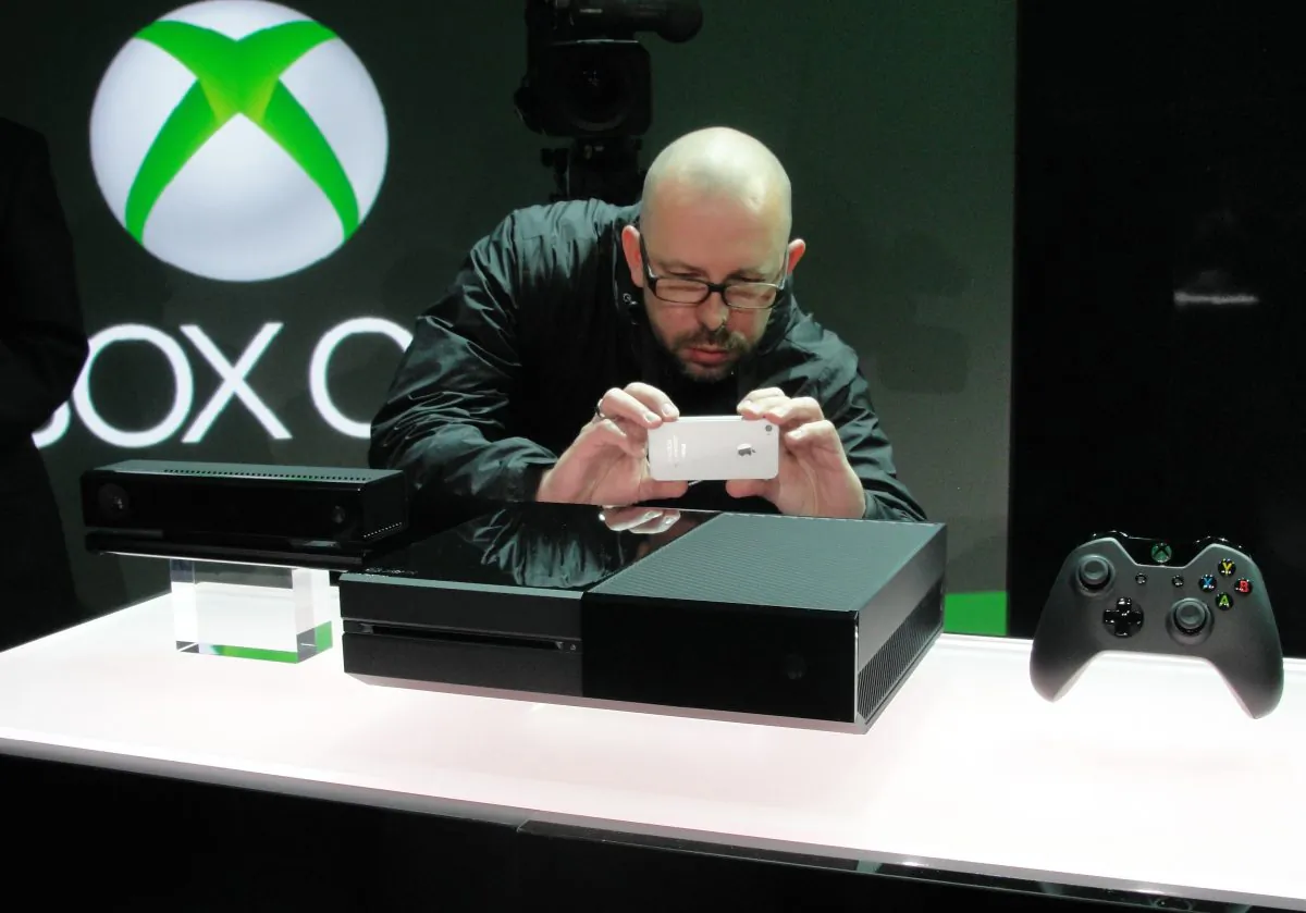 An iPhone is used to snap a picture of the next generation Xbox One videogame console at the Microsoft campus in Redmond, Wash., May 21. Microsoft touted its new Xbox as a home entertainment hub that goes far beyond games.
(Glenn Chapman/AFP/Getty Images)
