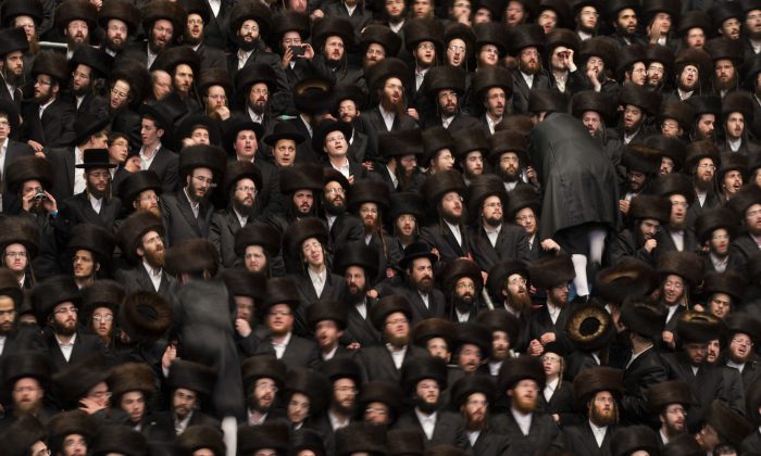 Tens of thousands of ultra-orthodox Jews of the Belz Hasidic Dynasty take part in the wedding ceremony of Rabbi Shalom Rokach, the Grandson of the Belz Rabbi to Hana Batya Pener, early morrning of May 22, 2013. (Uriel Sinai/Getty Images)