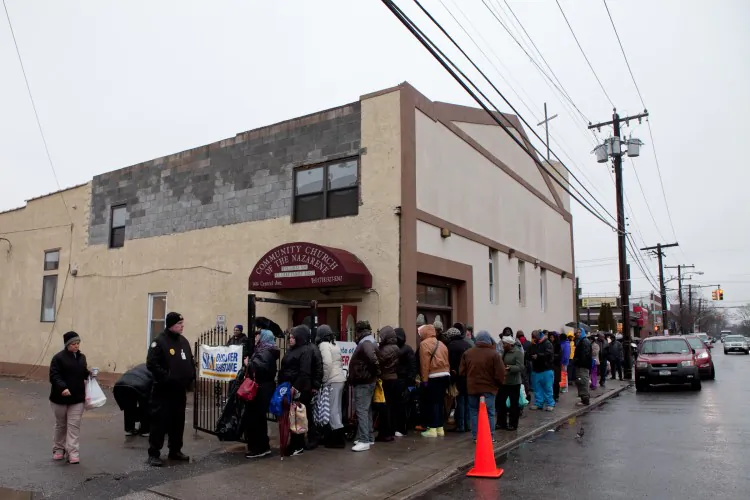 Far Rockaways residents line up for Hurricane Sandy disaster relief food and clothing at the Community Church of the Nazarene in Queens, New York, Jan. 16. (Samira Bouaou/The Epoch Times)
