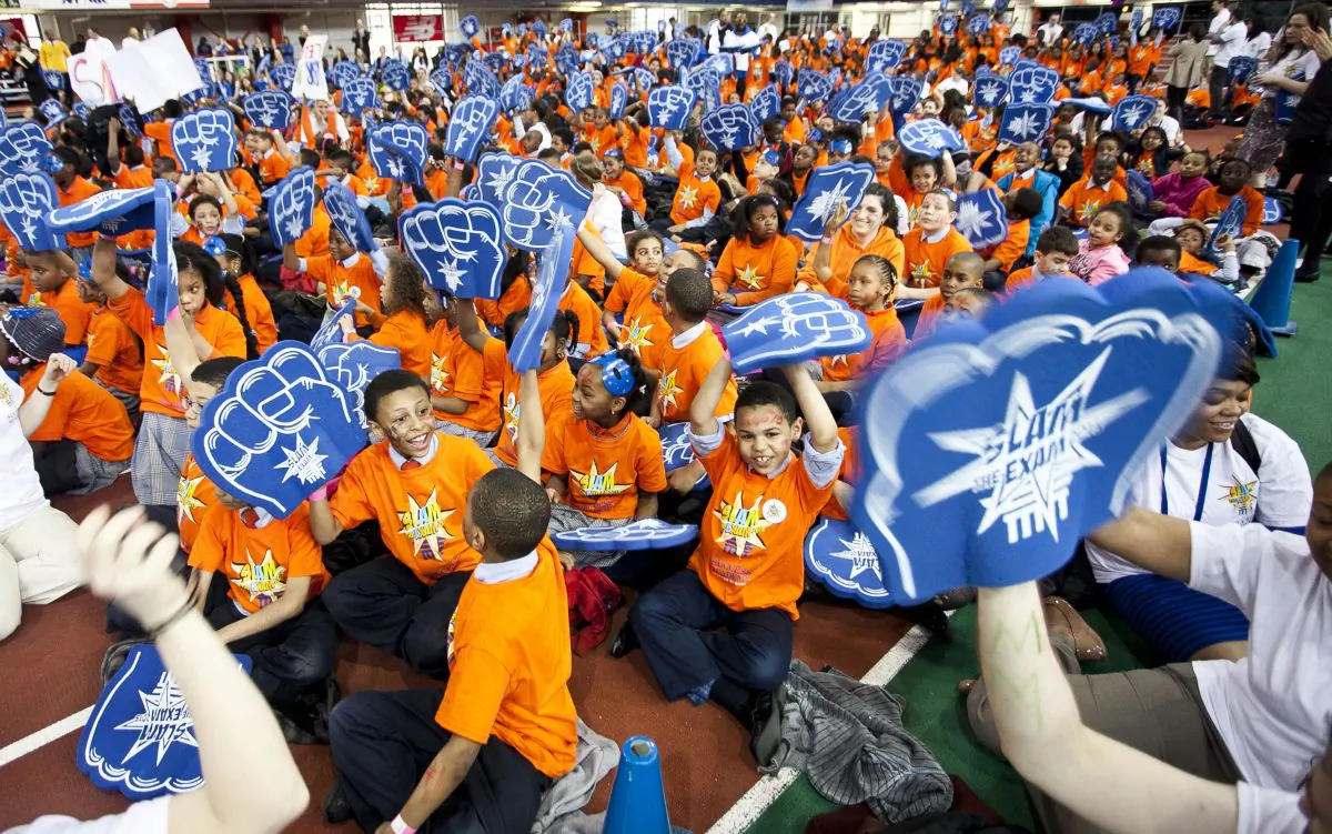 About 1,500 Success Academy students from 14 public charter schools in the Bronx and Harlem participate in a Slam the Exam Pep Rally on April 12 at the Washington Heights Armory, to encourage students prior to writing their first Common Core tests. (Samira Bouaou/Epoch Times)